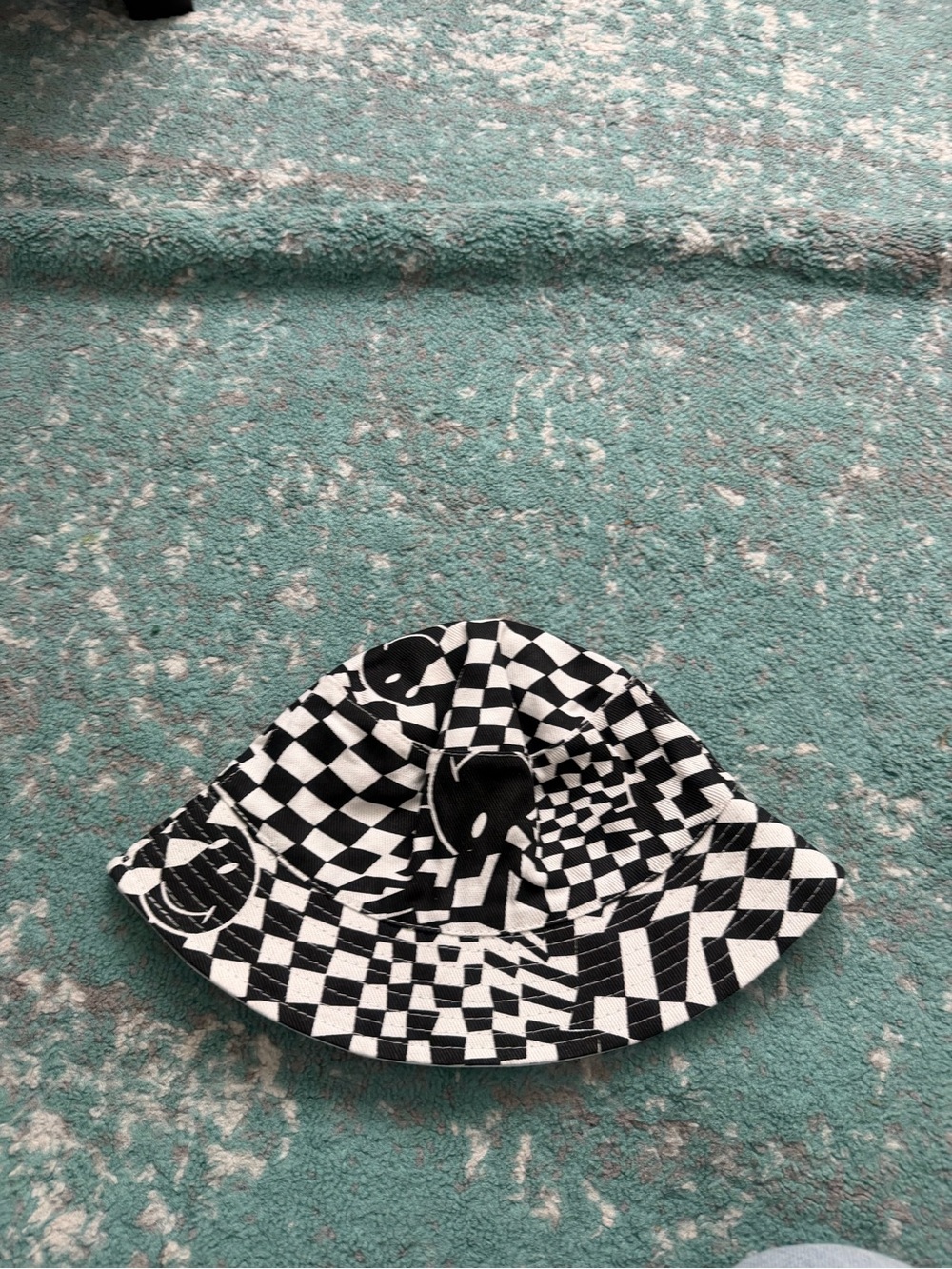 Tilly's Black and White Checkered Bucket Hat with Graphic Accents